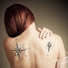 Girl with tattoos on her back