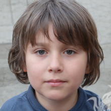 Foto de um menino com cabelo comprido em um perfil de 50 por 50 pixels
