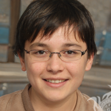 Photo of a boy wearing brunet glasses