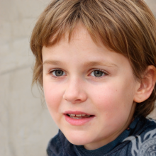 Photo of a brown-haired boy on a light background