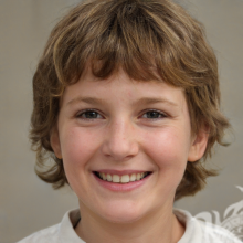 Photo of a brown-haired boy on a gray background
