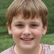 Photo of a red-haired boy in nature