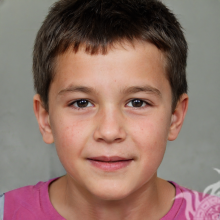 Photo of a boy with black hair on a gray background