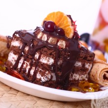 Photo cake with berries and orange slice