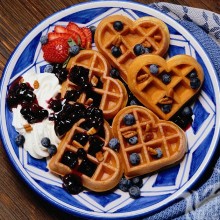Waffles with berries and jam