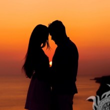 Photo of a pair of lovers on a sunset background