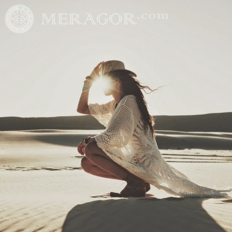 Funny photo of a girl in the desert In desert Without face In a cap Girls
