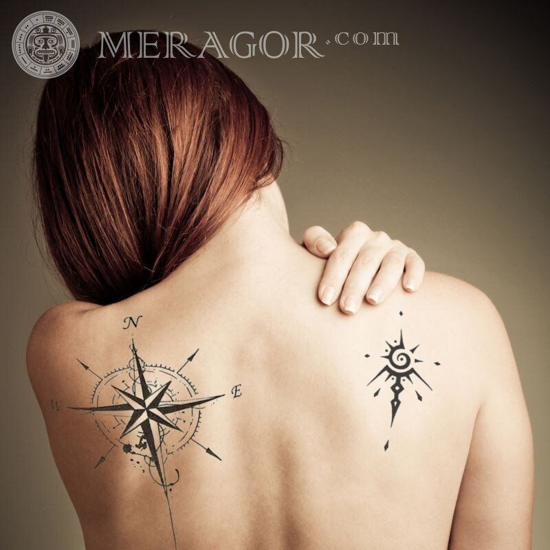 Girl with tattoos on her back From back