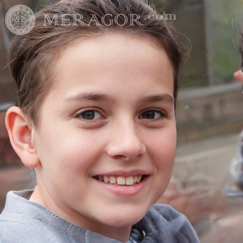 Portrait of a happy boy with a short hairstyle on the street Faces of boys Babies Young boys Faces, portraits