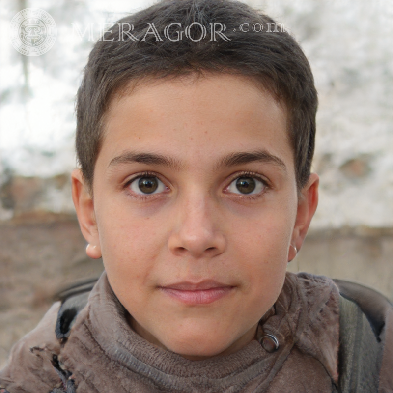 Photo of a brunette boy with short hair on the street Faces of boys Babies Young boys Faces, portraits