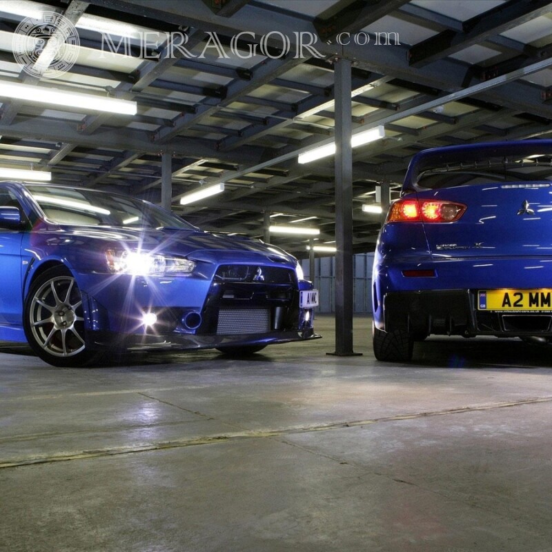 Laden Sie Foto zwei blaue Mitsubishi auf Ihr Profilbild herunter Autos Transport