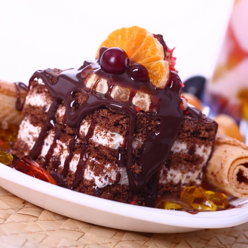 Photo cake with berries and orange slice Food