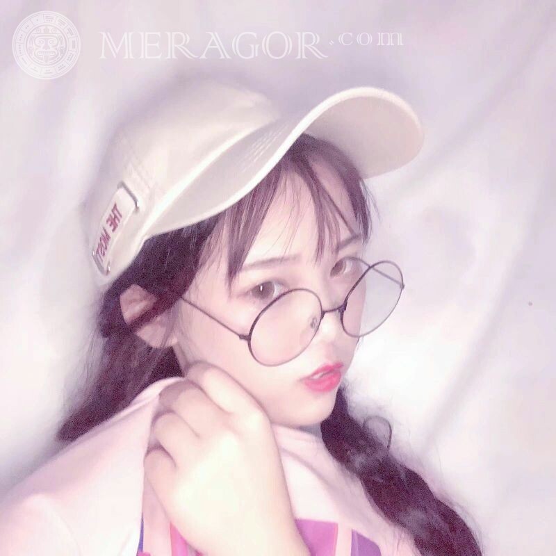 Photo of a girl in a cap for 14 years old Small girls Asians In a cap In glasses