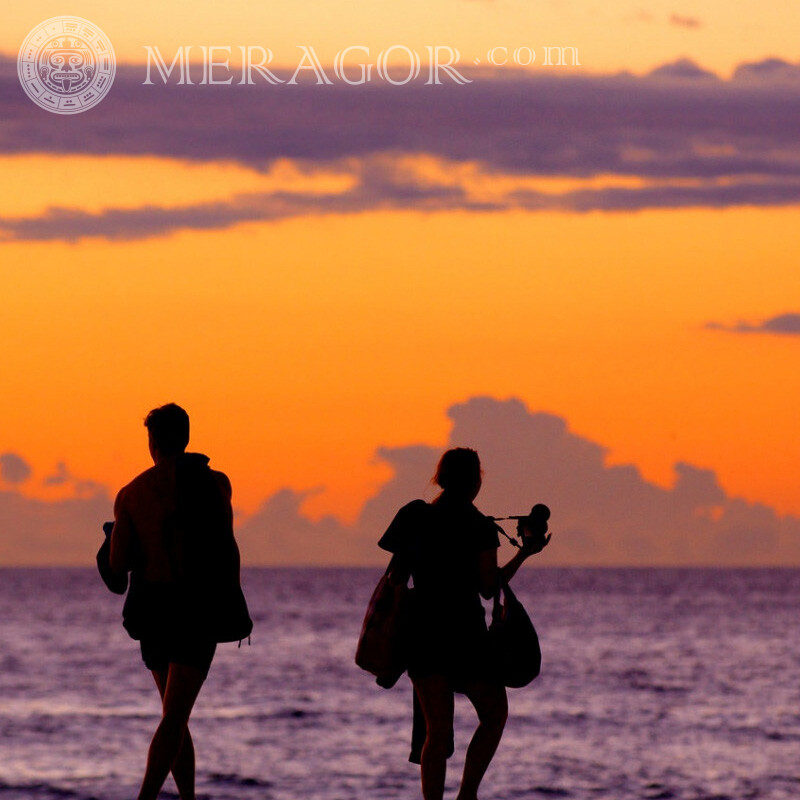 Tourists on the beach for social network Silhouette On the sea Boy with girl